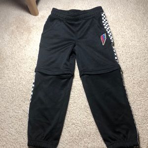 Nylon zip off track pants.